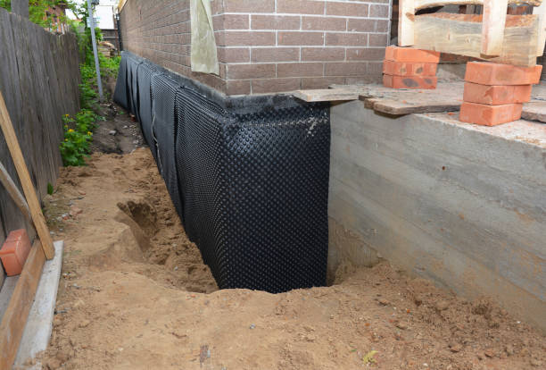 Happy homeowners after waterproofing job in Sewaren